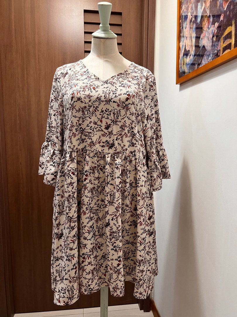 YOCO Floral Ruffle-Sleeve Dress (Category: Dresses) located in Singapore. Submitted by minni3scloset (Listing ID 1381029713, Image 1). Description: Delicate and breezy, this floral ruffle-sleeve dress by YOCO features a soft cream base adorned with vintage-inspired floral motifs in muted red, blush, and charcoal tones. The relaxed silhouette, gathered waist, and flared sleeves create a romantic and flattering look, perfect for casual brunches or 