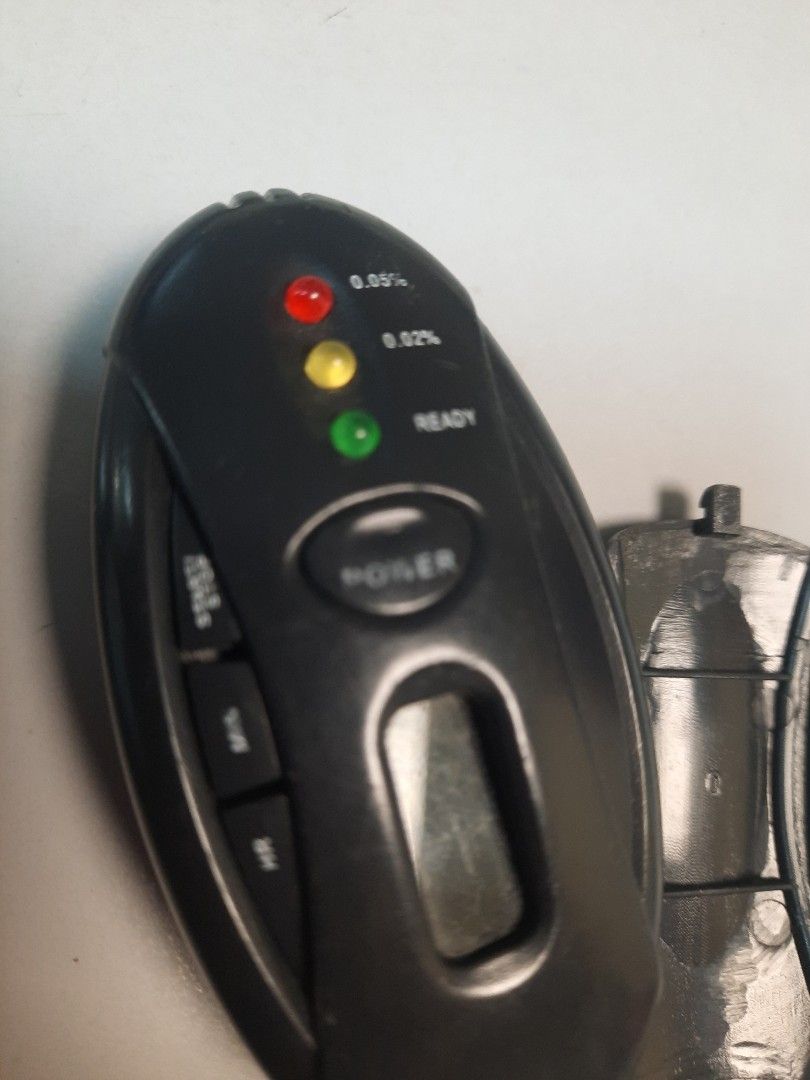 Remote controller (Category: Other PMDs & Parts) located in Singapore. Submitted by yangyy72 (Listing ID 1380914344, Image 3). Description: Compact breathalyzer with digital display and indicator lights. Requires AAA batteries (not included). Ensure safe driving..