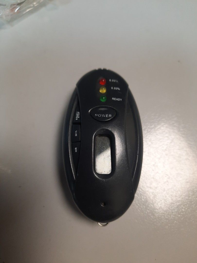 Remote controller (Category: Other PMDs & Parts) located in Singapore. Submitted by yangyy72 (Listing ID 1380914344, Image 1). Description: Compact breathalyzer with digital display and indicator lights. Requires AAA batteries (not included). Ensure safe driving..