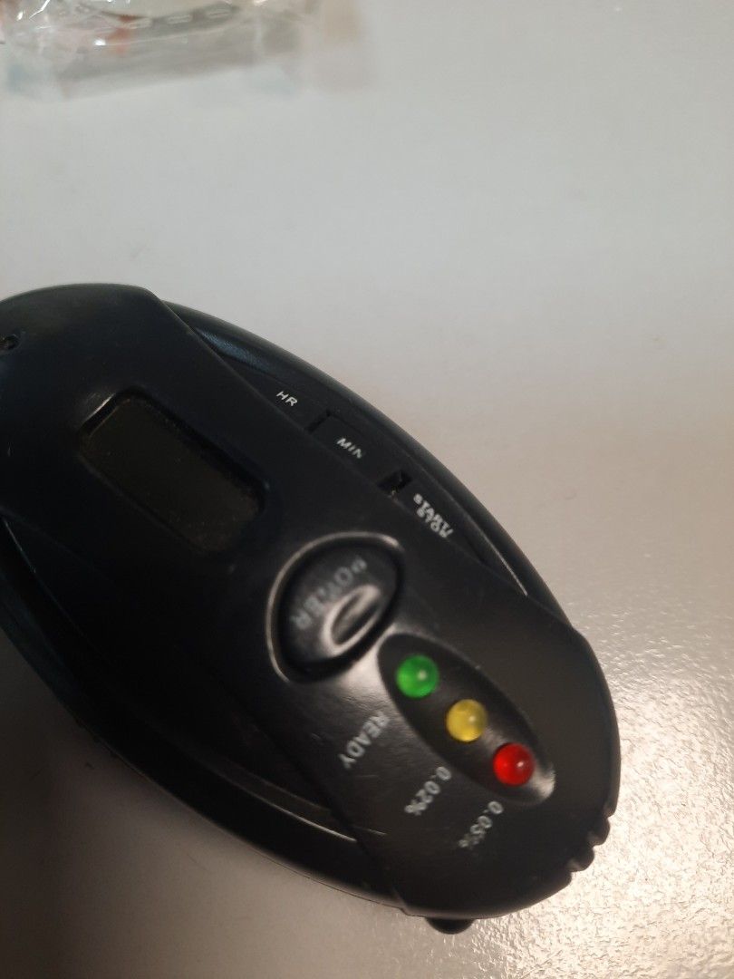 Remote controller (Category: Other PMDs & Parts) located in Singapore. Submitted by yangyy72 (Listing ID 1380914344, Image 4). Description: Compact breathalyzer with digital display and indicator lights. Requires AAA batteries (not included). Ensure safe driving..
