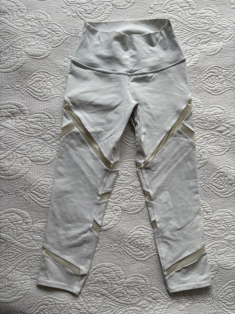 Alo Yoga White Mesh Panel Leggings - XXS (Category: Activewear) located in Singapore. Submitted by bunnbunn5566 (Listing ID 1381195658, Image 3). Description: These Alo Yoga leggings feature stylish mesh panel detailing. The size is XXS. Perfect for yoga, workouts, or casual wear. Made in Vietnam..