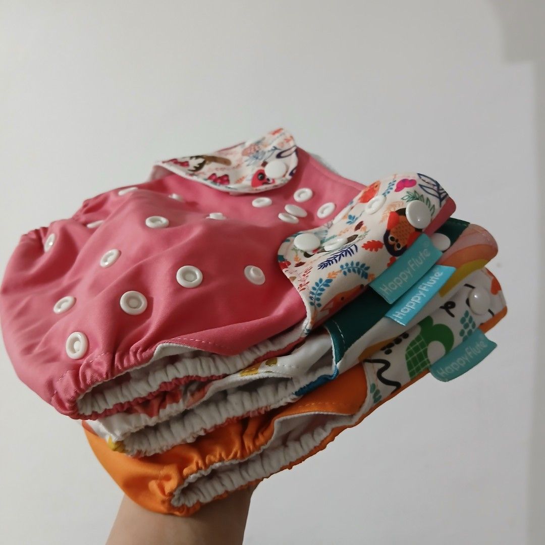 BABY CLOTH DIAPERS AND INSERTS (Category: Diapers & Baby Wipes) located in Taguig. Submitted by mayor_vito (Listing ID 1381087563, Image 3). Description: Slightly used 3 Happy Flute cds and 4 ABC by Zoey inserts *P129 for each item or P800 for take-all 7 pcs* -dark green and dark purple inserts have visible discoloration due to washing, so selling low -washed and kept pm me for more details thanks Loc: Taguig City mop: Gcash, Maya, BPI mod: sco, 