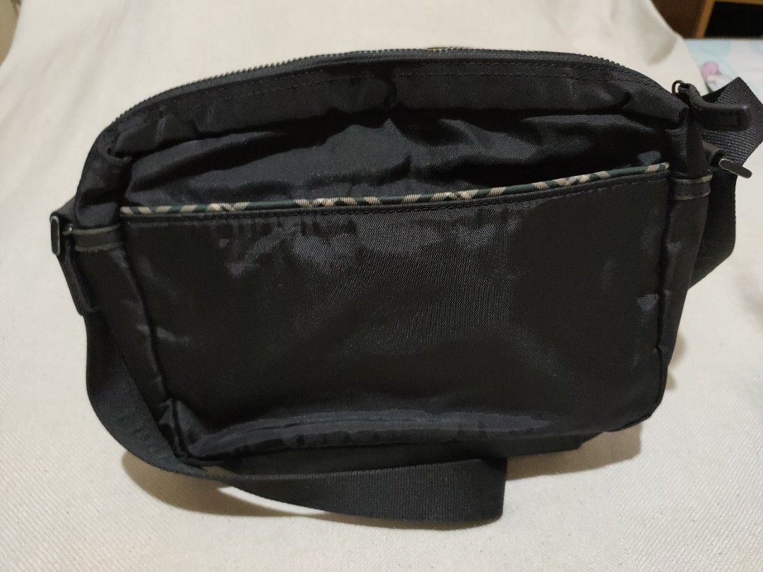 Bean Pole Authentic Sling Bag (Category: Sling Bags) located in Quezon City. Submitted by jhaneth21 (Listing ID 1381252135, Image 3). Description: 4 Compartments with Organizer Heavy Duty Nylon With Leather Trims Back Pocket Complete Tags & Hardware Logos Zip Puller Logos Size: 11" x 8" x 3.5".