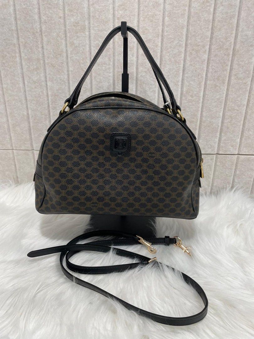 Celine vintage Macadam Top Handle Bag in Coated Canvas, Gold hardware (Category: Bags & Wallets) located in Singapore. Submitted by wendy.tan234 (Listing ID 1381094229, Image 1). Description: 100% authentic celine vintage bag. As it’s a vintage bag so there are definitely sign of use (please refer to pics). NOT FOR FUSSY BUYERS! Interior is still very clean! Will throw in a detachable long strap so you can use it as crossbody bag too. .