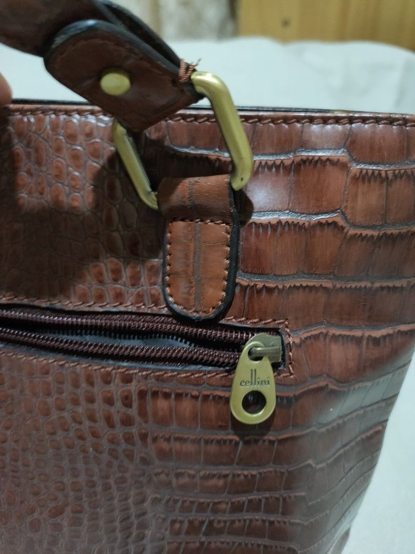 Cellini Authentic Crocodile Leather Bag (Category: Shoulder Bags) located in Quezon City. Submitted by jhaneth21 (Listing ID 1381251617, Image 3). Description: Crocodile Leather Bronze Hardware 3 Main Compartments With Organizer Pockets Front Zip Compartments Zip Pocket Organizer Ligo Embossed Lining Clean and Spacious Size: 12.5" x 9.5" x 4.5".
