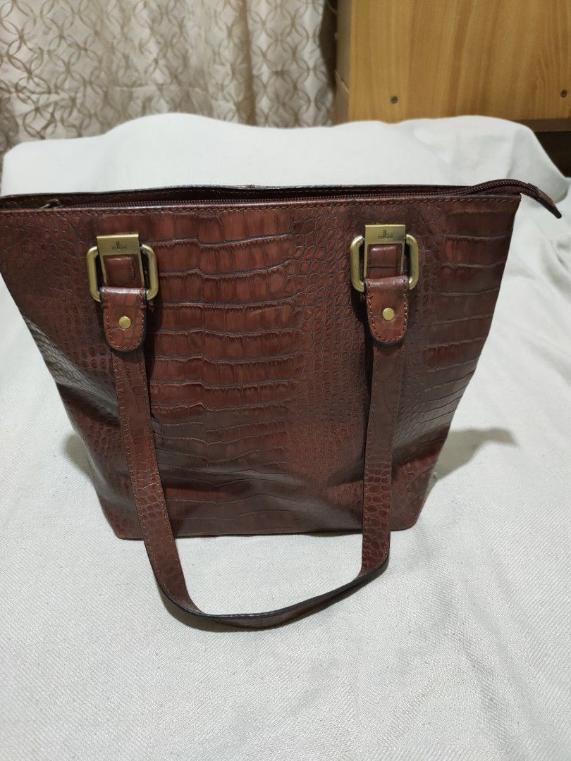 Cellini Authentic Crocodile Leather Bag (Category: Shoulder Bags) located in Quezon City. Submitted by jhaneth21 (Listing ID 1381251617, Image 1). Description: Crocodile Leather Bronze Hardware 3 Main Compartments With Organizer Pockets Front Zip Compartments Zip Pocket Organizer Ligo Embossed Lining Clean and Spacious Size: 12.5" x 9.5" x 4.5".