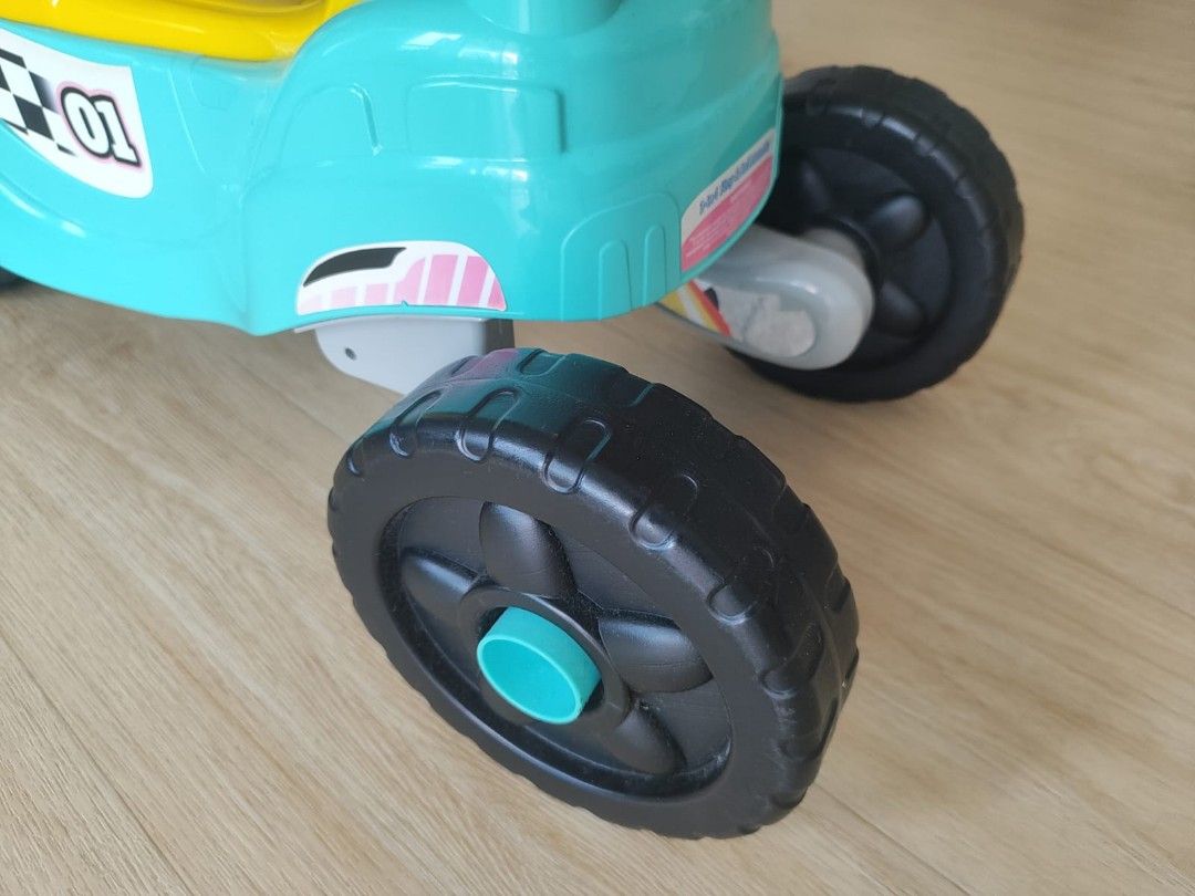 Kids' Ride-On Motorcycle Toy (Category: Toys & Games) located in Singapore. Submitted by nicesharebuy (Listing ID 1381141180, Image 3). Description: - Fun, colorful ride-on motorcycle for toddlers. - Interactive buttons and lights on the dashboard. - Sturdy 3-wheel design for stability. - Suitable for indoor and outdoor play. - Measurements available in photos..