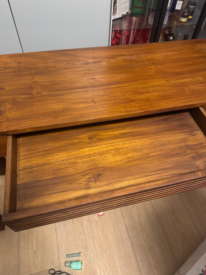 Solid wood side table (Category: Shelves, Cabinets & Racks) located in Singapore. Submitted by veganbooth (Listing ID 1381096246, Image 3). Description: Had this table for a while and the quality is really sturdy and the wood is well protected from elements. Comes with a small drawer perfect for keeping this table near your door to leave your keys and other barangs and important ones in the drawers (like spare keys) Size 120cm (Length) x 40cm (Wi