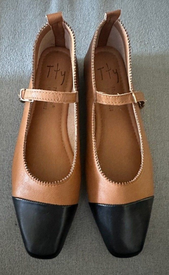 two toned leather mary janes (Category: Flats & Sandals) located in Pasig City. Submitted by authph (Listing ID 1381230642, Image 1). Description: black cap toe and tan vegan leather.
