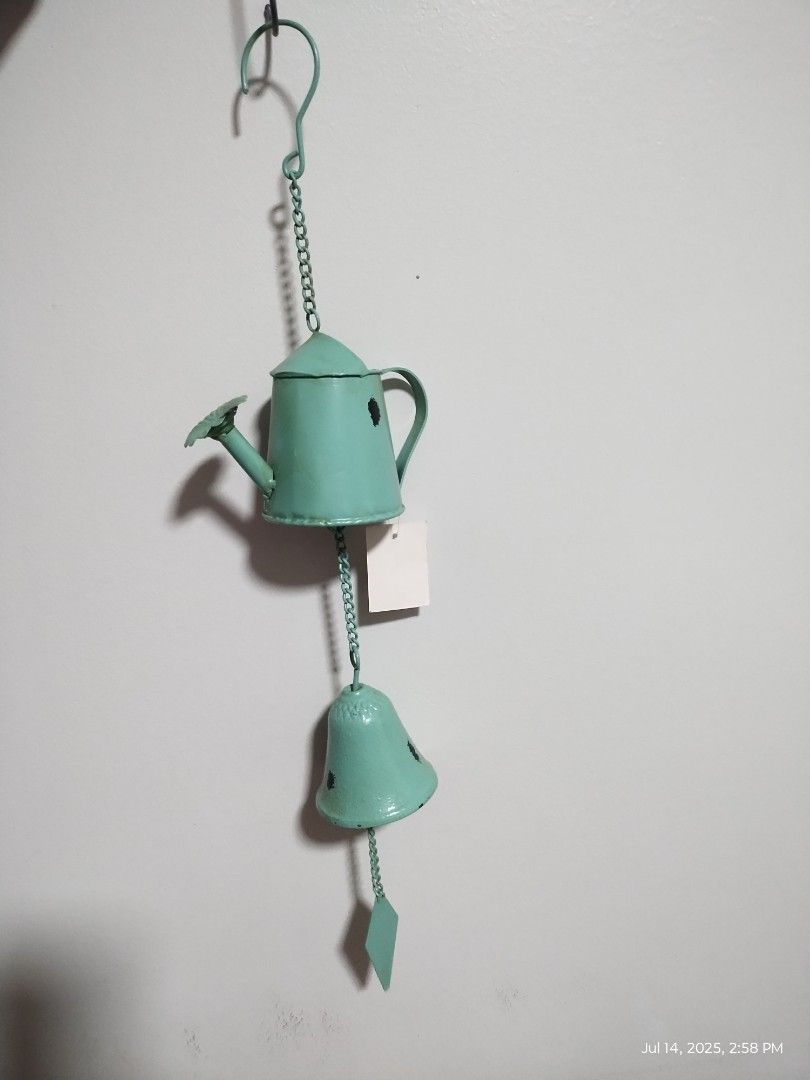 WIND CHIME (Category: Gardening Tools & Ornaments) located in Paranaque City. Submitted by maapolonio (Listing ID 1381122582, Image 1). Description: vintage designed water pot and bell made of solid metal.
