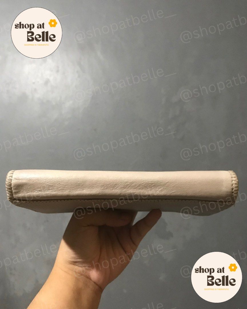 Beige w/ Button Long Wallet (Category: Wallets & Card holders) located in Pasig City. Submitted by shopatbelle___ (Listing ID 1381323445, Image 3). Description: 👛 Beige w/ Button Long Wallet ✨ 7/10, visible color transfer due to item longetivity. 🧷Item Origin: 🇲🇾 💰Price: ₱450.00 📍 Pasig City 🤝🏻 Meet-Up: Capitol Commons / Ayala 30th / Shangri-La EDSA / SM Megamall / Podium (ONLY) 💳 MOP: E-Wallet or Bank Transfer 📦 MOD: Lalamove / Grab / 