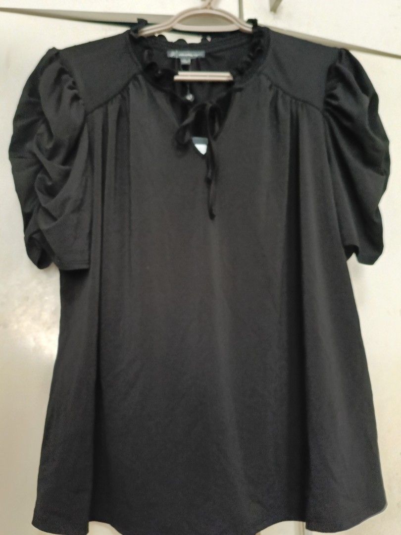 Black puff sleeve top (Category: Blouses) located in Quezon City. Submitted by coco_pet (Listing ID 1381367610, Image 1). Description: Brand new with tags.