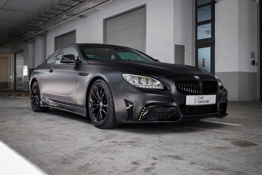 BMW 6 Series Coupe 640i Coupe Sunroof Auto (Category: Used Cars) located in Singapore. Submitted by thecarground (Listing ID 1334323115, Image 3). Description: Full loan monthly at $16xx only! Full matte black look, sleek and sexy. Fully stocked apart from aesthetics. Strongly advised to view. Very well maintained for its age. 3 owner with Super low mileage. Full servicing records available. Chat with our sales team today. Flexible loan and trade