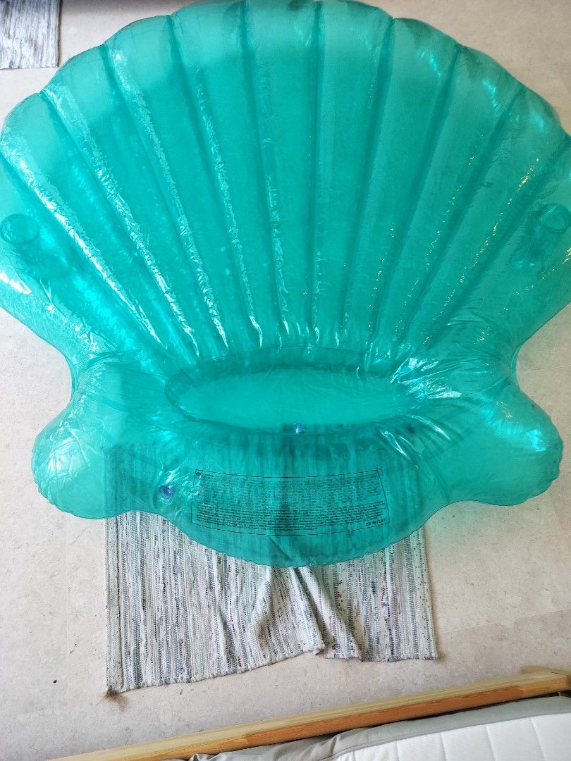 Teal Seashell Inflatable Pool Float (Category: Water Sports) located in Singapore. Submitted by guerra312 (Listing ID 1381357201, Image 3). Description: - Teal seashell-shaped inflatable pool float - Excellent condition - Perfect for summer fun - Suitable for kids and adults - Can fit up to 2 adults - Has 2 cup holders on each side - About 1.8 metres tall - Only available in the United States, very high quality.