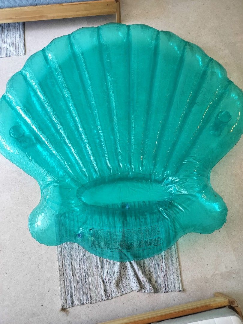 Teal Seashell Inflatable Pool Float (Category: Water Sports) located in Singapore. Submitted by guerra312 (Listing ID 1381357201, Image 4). Description: - Teal seashell-shaped inflatable pool float - Excellent condition - Perfect for summer fun - Suitable for kids and adults - Can fit up to 2 adults - Has 2 cup holders on each side - About 1.8 metres tall - Only available in the United States, very high quality.