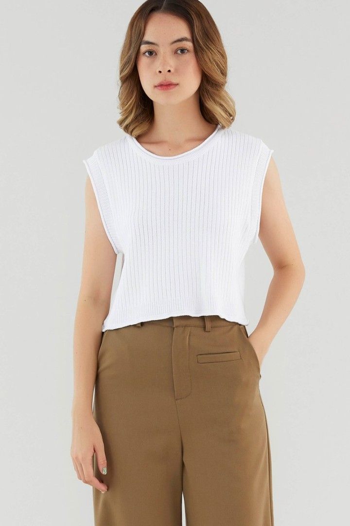 The Editors Market (TEM) Alyra Knit Top - Black and White (Category: Sleeveless) located in Singapore. Submitted by hannahlsh (Listing ID 1381300398, Image 2). Description: - Sleeveless ribbed top - Available in black and white - 1 for $18, 2 for $30 - Crew neck - Flattering fit - Perfect for layering or wearing alone - Suitable for casual and semi-formal occasions - Comfortable and versatile.