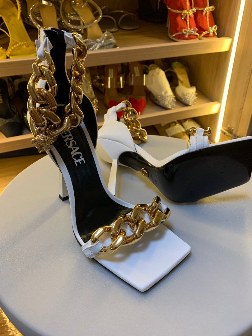 VERSACE MEDUSA CHAIN HIGH HEELS SANDALS (Category: Sneakers & Footwear) located in Pasay City. Submitted by slashed (Listing ID 1381319089, Image 3). Description: PRELOVED USED (Twice) no box Description Set on a high stiletto heel, these leather sandals are enriched with a Medusa charm on the ankle strap and feature a chunky chain detail on the toe strap. DETAILS & CARE - Medusa hardware - Square toe - High heel - Outer fabric: 100% Nappa leathe