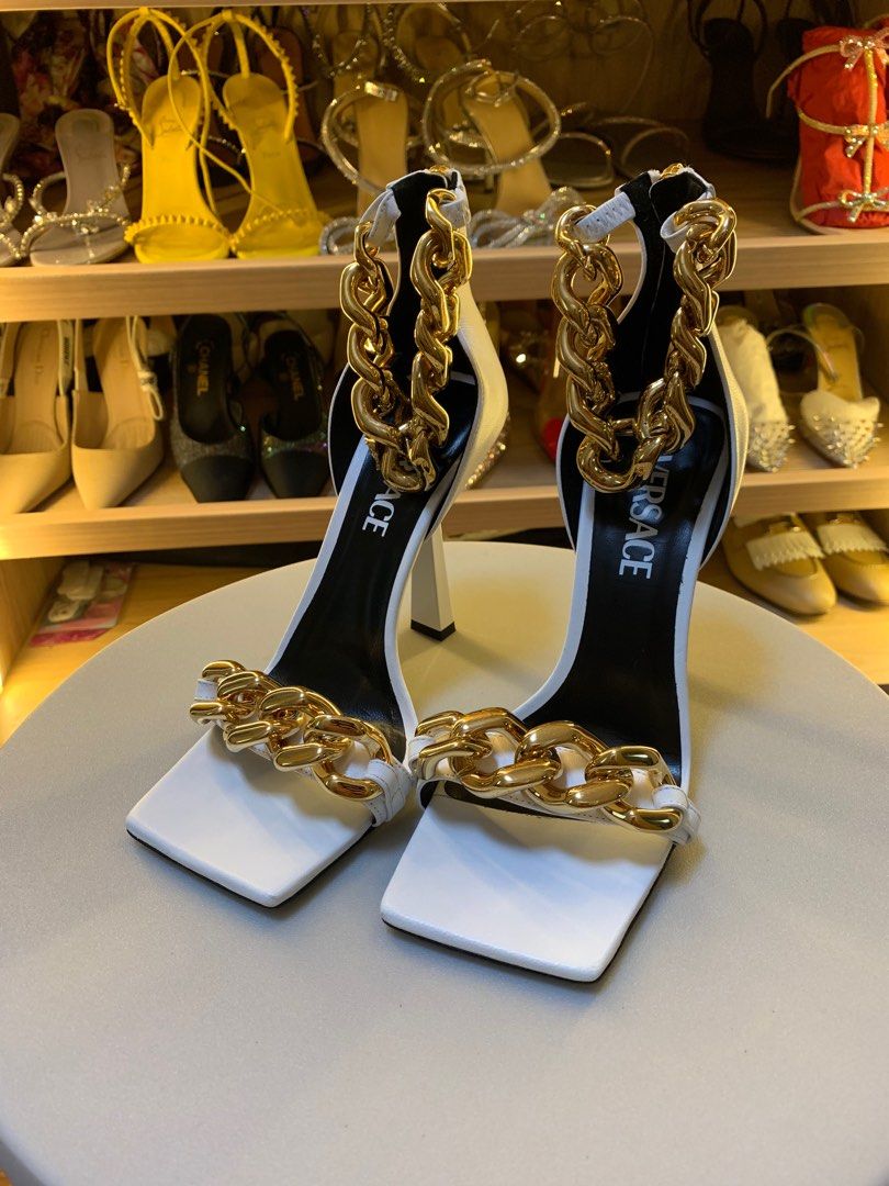 VERSACE MEDUSA CHAIN HIGH HEELS SANDALS (Category: Sneakers & Footwear) located in Pasay City. Submitted by slashed (Listing ID 1381319089, Image 2). Description: PRELOVED USED (Twice) no box Description Set on a high stiletto heel, these leather sandals are enriched with a Medusa charm on the ankle strap and feature a chunky chain detail on the toe strap. DETAILS & CARE - Medusa hardware - Square toe - High heel - Outer fabric: 100% Nappa leathe