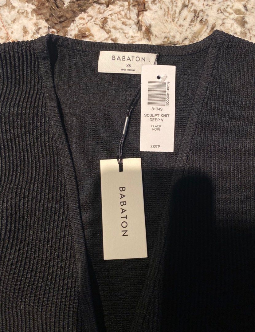 Aritzia- Babaton Sculpt Knit Deep V - XS (Category: Sleeveless) located in Quezon City. Submitted by flourency (Listing ID 1381582185, Image 3). Description: Never worn, tags still on, ribbed black tank from Aritzia. Firm price Location: Katip / Rockwell. .