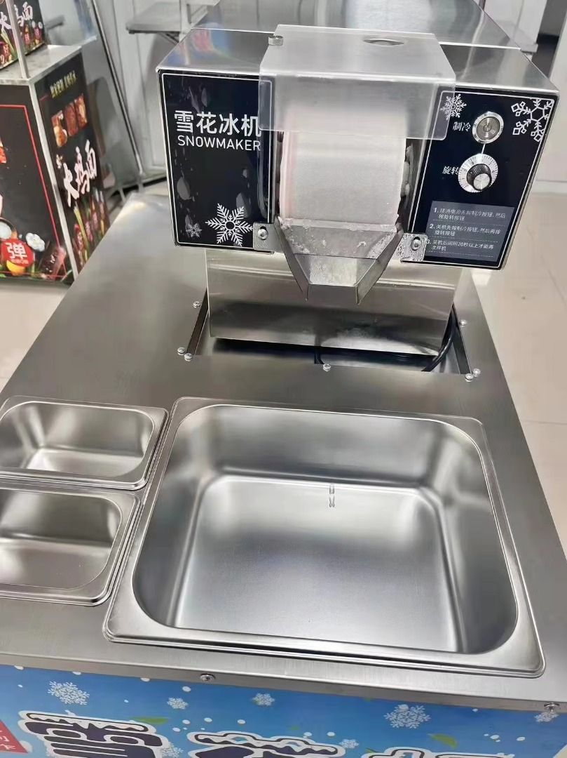 Bingsu Machine Snow Ice Shaving Machine (Category: Other Kitchen Appliances) located in Manila. Submitted by makinaryageneral.merchandise (Listing ID 1381466257, Image 3). Description: Model : ZB-XBJ60 Voltage : 220v 60hz Power : 360w Production : 60kgs daily Refrigerant : R290 Materials : Stainless Steel Roller Length : 8cm Dimension : 29x48.5x34cm Net Weight : 18.5kgs .