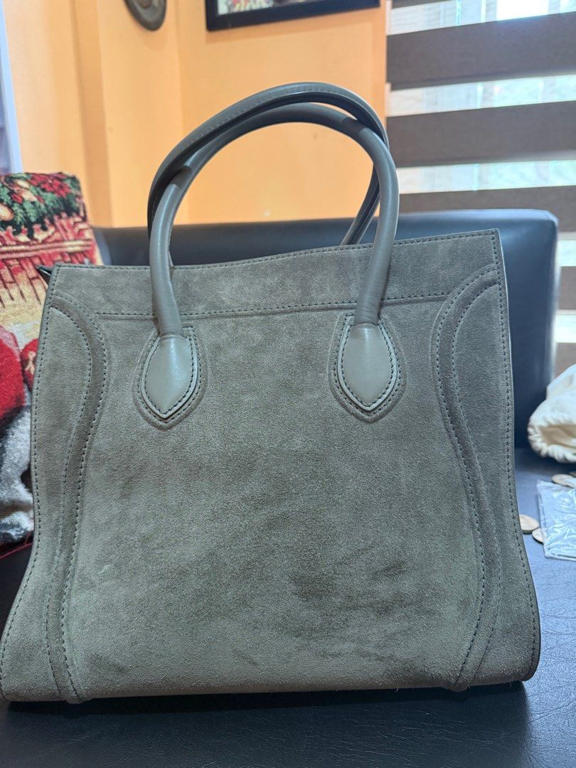 Celine Luggage Phantom in grey suede (Category: Luxury Bags & Wallets) located in Manila. Submitted by caseforless (Listing ID 1381477900, Image 3). Description: 🖇️ Details: Material: Grey suede leather. Style: Casual yet luxurious, with a distinctive silhouette and sturdy handles. Size: Larger than the standard Luggage bag, with a wider base and adjustable wings. Details: Features the signature “wings” and a braided zipper pull. Interior: Lined