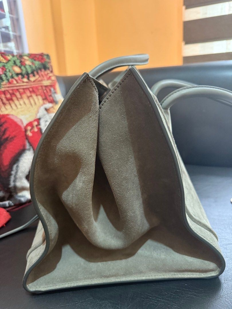 Celine Luggage Phantom in grey suede (Category: Luxury Bags & Wallets) located in Manila. Submitted by caseforless (Listing ID 1381477900, Image 2). Description: 🖇️ Details: Material: Grey suede leather. Style: Casual yet luxurious, with a distinctive silhouette and sturdy handles. Size: Larger than the standard Luggage bag, with a wider base and adjustable wings. Details: Features the signature “wings” and a braided zipper pull. Interior: Lined