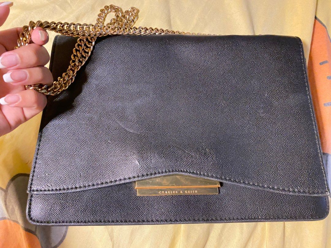 Charles & Keith shoulder bag (Category: Shoulder Bags) located in Caloocan City. Submitted by declutter.camille (Listing ID 1381483160, Image 1). Description: Handle can be adjusted for shoulder bag or handbag. Just needs some cleaning .
