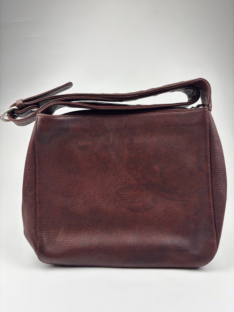 JIL SANDER Archive Leather Crossbody Bag (Category: Luxury Bags & Wallets) located in Makati City. Submitted by ragrepository (Listing ID 1381646147, Image 3). Description: JIL SANDER Archive Leather Crossbody Bag Height- 10.5” Width- 11.5” Depth-2.5” Strap drop-18.5” (adjustable) Condition- 9/10 Flaw- Minimal wear, Leather Patina .