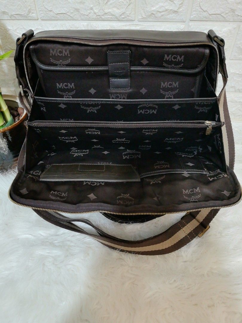 🔹MCM 2WAY BRIEFCASE LEATHER DOCUMENT MESSENGER LAPTOP BAG🔹 (Category: Luxury Bags & Wallets) located in Paranaque City. Submitted by sophiasamcloset (Listing ID 1381552459, Image 3). Description: 🔹💯% GUARANTEED AUTHENTIC / ORIGINAL MCM 2WAY BRIEFCASE LEATHER DOCUMENT MESSENGER LAPTOP BAG. 🔹MADE in KOREA 🔹YKK zipper 🔹with Detachable Laptop compartment. 🔹DIMENSIONS ➡️Height : 10 inches ➡️Length : 14 inches ➡️Width : 3 inches 🔹MEETUP🔹 ➡️ S