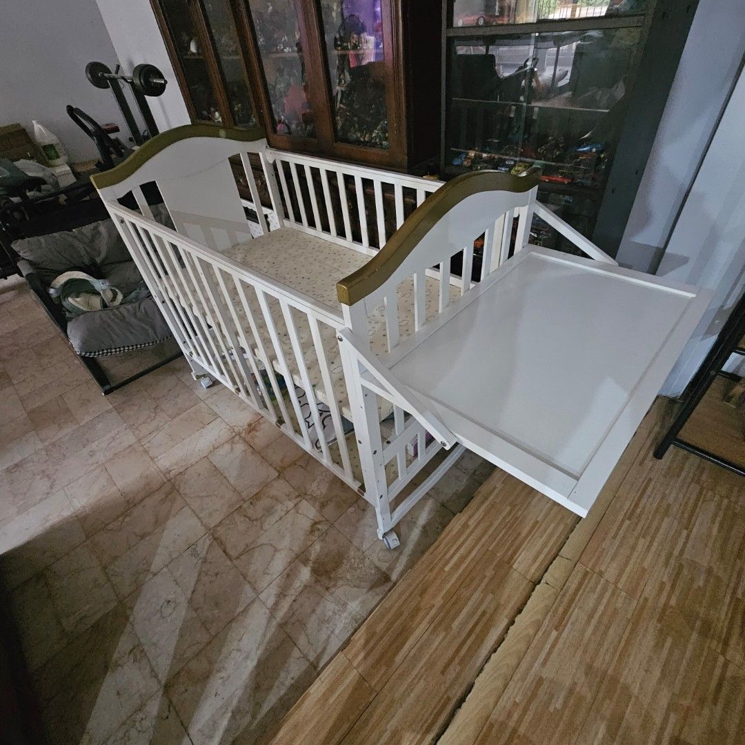 MULTIFUNCTIONAL 10 in 1 crib ‼️ (Category: Cots & Cribs) located in Quezon City. Submitted by pablopenalbaii24 (Listing ID 1381637289, Image 2). Description: MULTIFUNCTIONAL 10 in 1 crib ‼️ *Taylor white crib made in pine wood material with wheels rocking crib can be converted into bed big storage with changing diaper free foam only free mosquito net with stand Bought for 11,500.