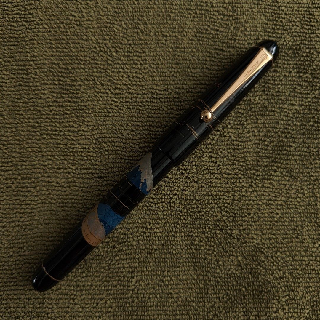 Pilot Namiki Urushi Lacquer Nippon Art Hira Makie Rollerball Pen - Mount/Mt. Fuji and Ship (Category: Other Stationery & Craft) located in Singapore. Submitted by femscout (Listing ID 1381493991, Image 2). Description: 🔹Condition: Like New 🔹New Pelikan refill inserted (Black, 0.7mm) 🔹Pen accepts Pilot GLB 7, Pilot G2 and Pelikan 338 refills 🔸Meetups: Kaki Bukit MRT (DT28) 🔵 Kembangan MRT (EW6) 🟢 Marine Terrace MRT (TE27) 🟤 🔸Complimentary 