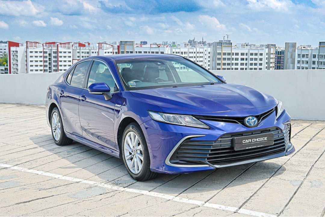 Toyota Camry Hybrid 2.5A Ascent Auto (Category: Used Cars) located in Singapore. Submitted by sgcarchoice (Listing ID 1381567952, Image 2). Description: Features: Powered by 2.5L inline 4 cylinder Hybrid engine producing a total of 214bhp and 221nm, e-CVT automatic, keyless entry/start. Accessories: Original bluetooth media player, multi function steering wheel, front and rear sensor and reverse camera, leather seats, original carpet, in car cams