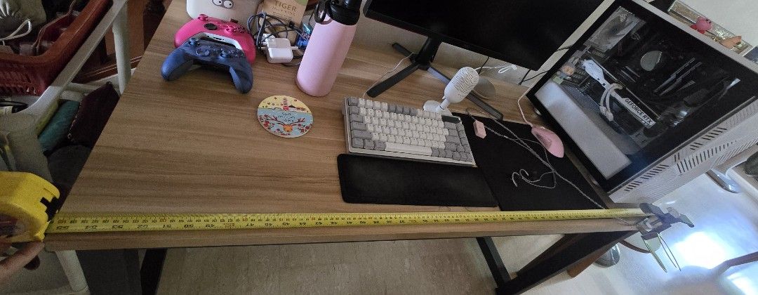 Table (Category: Tables & Sets) located in Singapore. Submitted by blackheartz (Listing ID 1381508891, Image 3). Description: - Sleek wooden desk - Spacious tabletop: 140cm (L) x 60cm (W) - Perfect for gaming or work - Sturdy metal legs for stability - Board thickness: 2.5cm - Good condition Please arrange for your own Delivery.