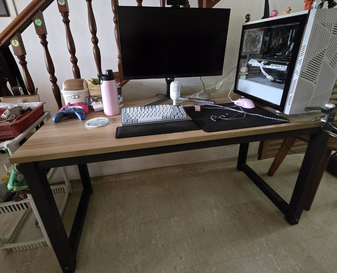 Table (Category: Tables & Sets) located in Singapore. Submitted by blackheartz (Listing ID 1381508891, Image 2). Description: - Sleek wooden desk - Spacious tabletop: 140cm (L) x 60cm (W) - Perfect for gaming or work - Sturdy metal legs for stability - Board thickness: 2.5cm - Good condition Please arrange for your own Delivery.