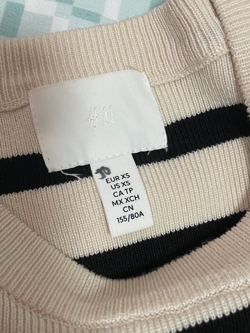 Authentic H&M Cream and Black Ribbed Top (Category: Shirts) located in Quezon City. Submitted by mnl.declutter (Listing ID 1378198574, Image 3). Description: Authentic H&M Cream and Black Ribbed Top •washed but never worn •tag has small writing in marker •bigger size Size guide •shoulder width ≈ 15.5 in •width ≈ 16 in •length ≈ 19 in •sleeve length ≈ 7 in DM for any questions or inquiries! 😊 MOP - Gcash SF - c/o buyer.
