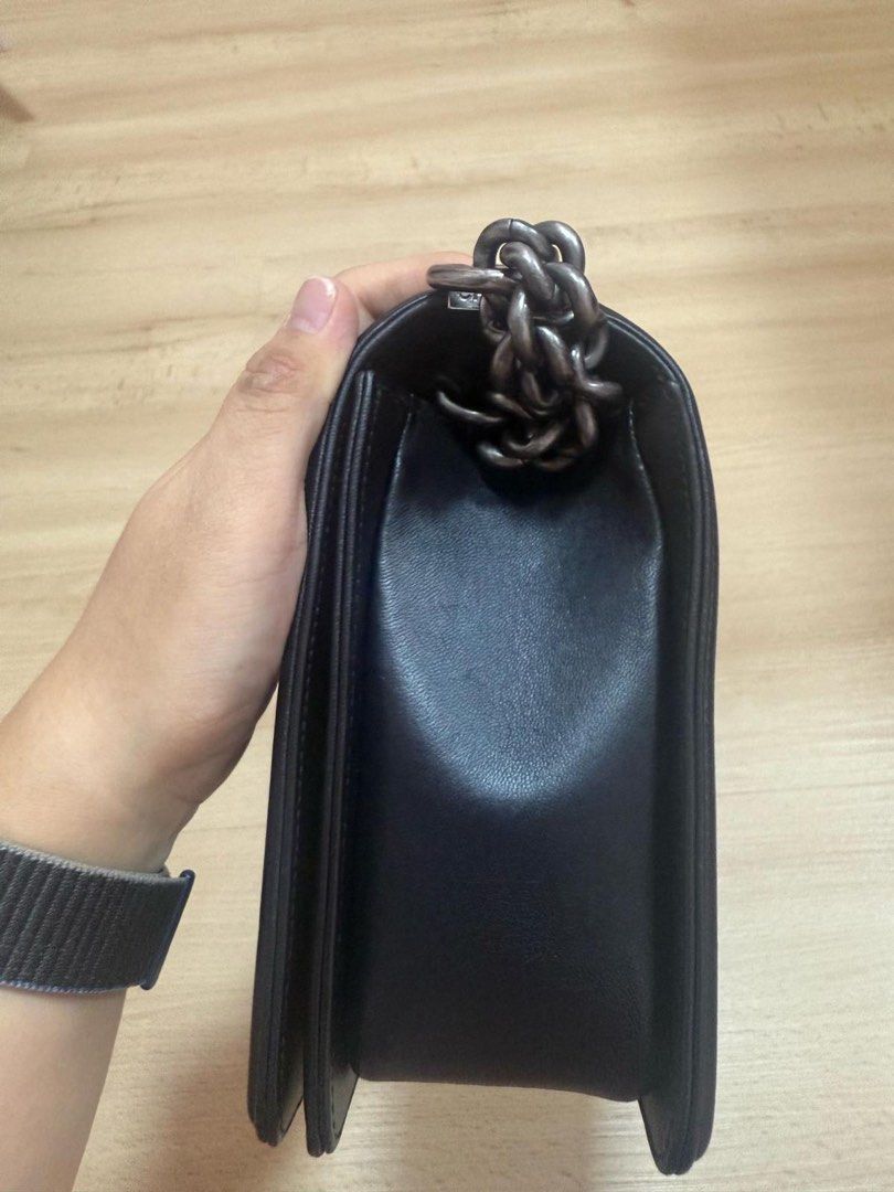 Chanel Boy New Medium - 28cm Quilted Lambskin Black Ruthenium Silver Hardware Series 21 (Category: Bags & Wallets) located in Singapore. Submitted by kengb (Listing ID 1378194802, Image 2). Description: Used Chanel Boy 28cm bag. Refer to title for the model. Come with certificate, dust bag and box (some flaw on the corner). PM to make arrangement to view the bag..