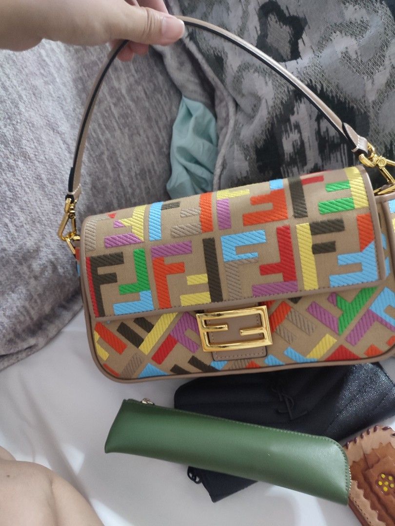Fendi multi-colored canvass baguette (Category: Shoulder Bags) located in Quezon City. Submitted by kimpossibleme (Listing ID 1378272292, Image 3). Description: Very pretty. Good size, can fit a long wallet and a few items. Comes with 2 straps, one wide, one slim. Used a few times only. Bought in Japan. Not sure about authenticity but it's coded. Uploaded as many pics as I can here. RFS: Decluttering..