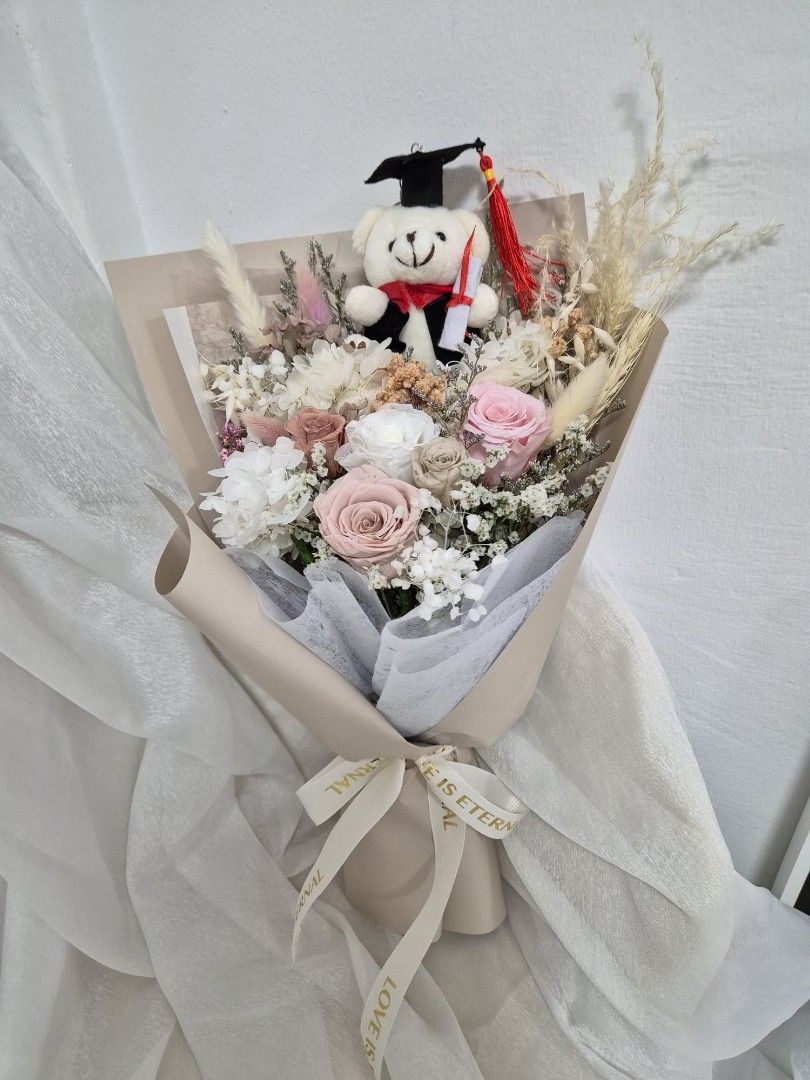 Graduation bouquet| graduation flower| preserved flowers bouquet| premium preserved roses with graduation bear| flower|graduation gifts| congratulatory| dried flower| flower delivery| grad day (Category: Flowers & Bouquets) located in Singapore. Submitted by clefcreations (Listing ID 1378252090, Image 3). Description: prices are before discounts ✨️ prices from $66 Free gift card and paper bag 🐧 Please note: 🚙 $10 to $15 depending on locations. 