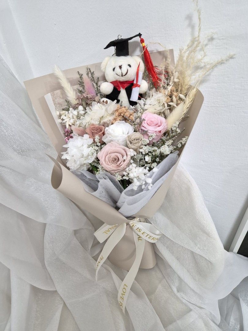 Graduation bouquet| graduation flower| preserved flowers bouquet| premium preserved roses with graduation bear| flower|graduation gifts| congratulatory| dried flower| flower delivery| grad day (Category: Flowers & Bouquets) located in Singapore. Submitted by clefcreations (Listing ID 1378252090, Image 1). Description: prices are before discounts ✨️ prices from $66 Free gift card and paper bag 🐧 Please note: 🚙 $10 to $15 depending on locations. 