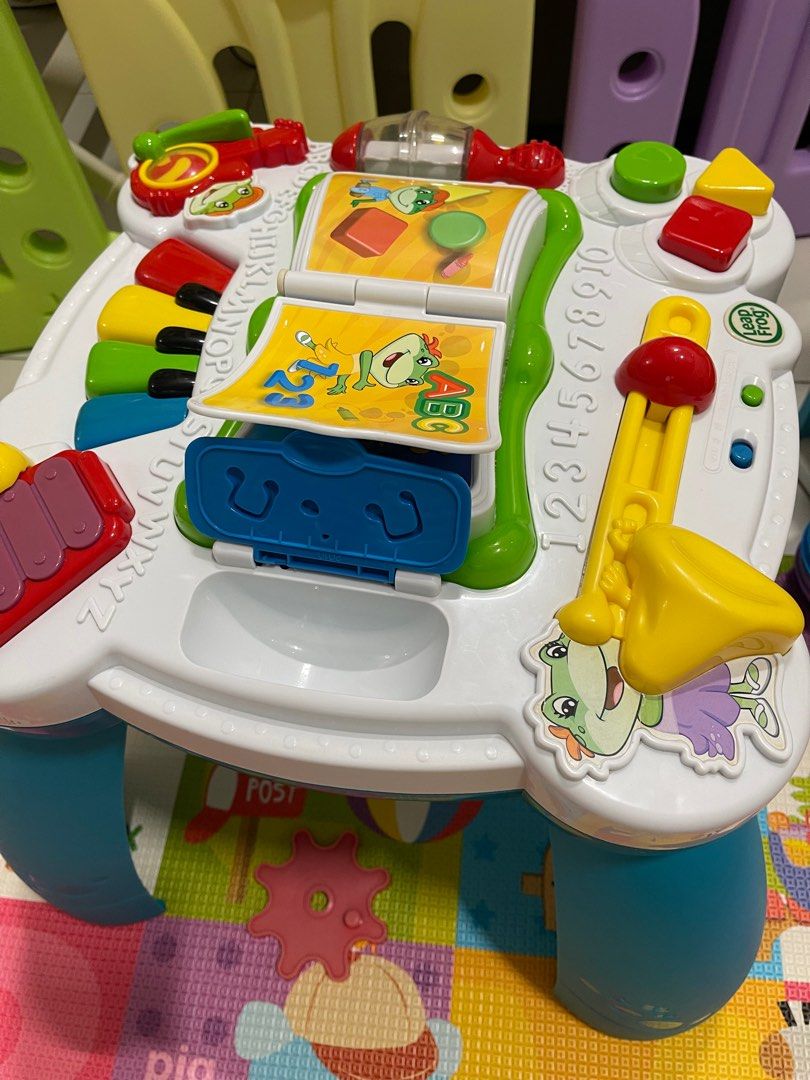 LeapFrog Musical Learning Table (Category: Infant Playtime) located in Singapore. Submitted by kiekai (Listing ID 1378218144, Image 1). Description: This LeapFrog Musical Learning Table is a fun and educational toy for toddlers. It features various musical instruments, interactive books, and learning activities. The table is in good condition and ready for a new home. Self collect at Punggol Spring .