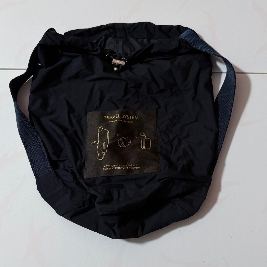 Louis Vuitton Travel System Bag (Category: Bags & Wallets) located in Singapore. Submitted by x4vyer (Listing ID 1378321545, Image 1). Description: This is a Louis Vuitton Travel System bag in navy blue (pouch for jacket). It features a drawstring closure and 2 side handles. The bag is in excellent condition, showing minimal signs of wear. Perfect for travel or everyday use. Height: Diameter:.