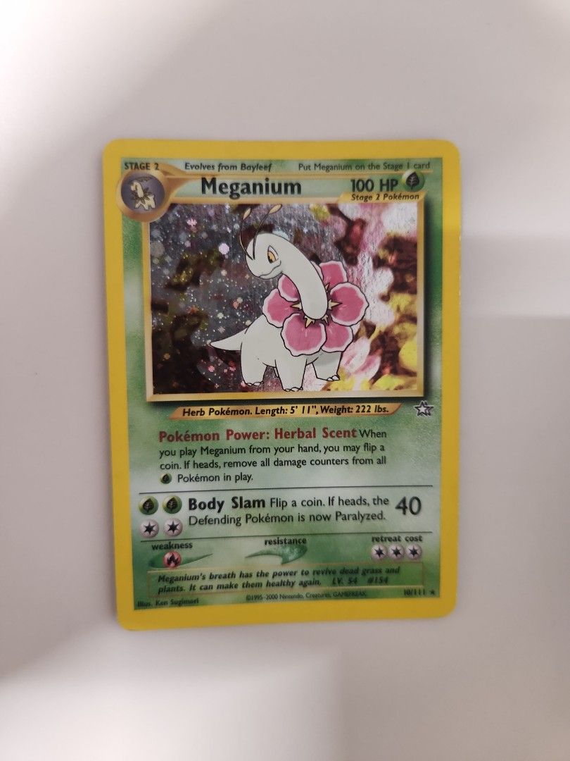 Meganium Holo Neo Genesis (tags Umbreon Pokemon Rayquaza Charizard Prismatic Evolutions Mewtwo Mew PSA 10 Alt Art Alternate Art Crown Zenith Black Bolt White Flare SAR Gold Star XY Generations) (Category: Toys & Games) located in Singapore. Submitted by chunkychu (Listing ID 1378310263, Image 1). Description: Selling this Meganium Holo Neo Genesis Card. 🔥 Unsleeved condition as shown, at least LP, no creases, dents or severe damages. Feel free t