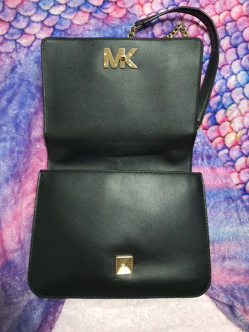 Michael Kors Mott Black Leather Shoulder Bag (Category: Luxury Bags & Wallets) located in Subic. Submitted by camillealdrin (Listing ID 1378267793, Image 3). Description: Michael Kors Mott Black Leather Gold Chain Large Shoulder/CrossBody Bag Manufacture Date Code: AC-2001 Made In Indonesia MK Code: 35S0GOXL3L Pre-loved but well loved bag Used for special occasions No rubs on rubber lining No body cracks Scratches on metals which is normal Dents 