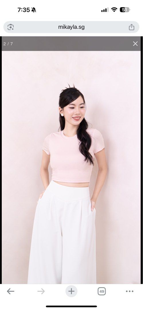 Mikayla Zenda Baby Tee Baby Pink (Category: Sleeveless) located in Singapore. Submitted by mbl_mbl (Listing ID 1378160563, Image 2). Description: Beautiful pink crop top from Mikayla.sg. Features a flattering cut with a back cutout. Made from a comfortable material. Please refer to the size chart in the images for measurements. Perfect for a stylish and chic look..
