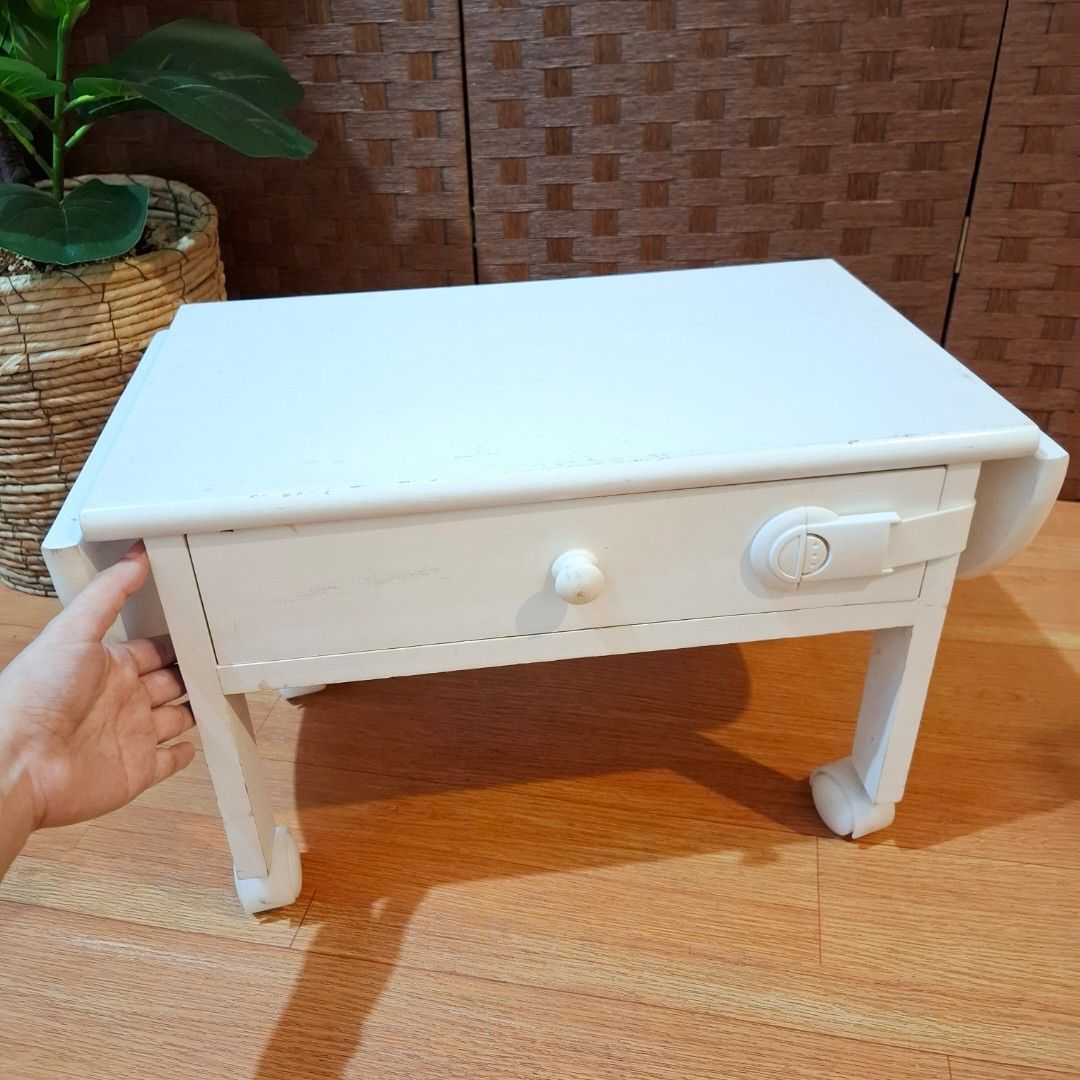Mini drop leaf laptop table desk solid wood with drawer (Category: Tables & Sets) located in Dasmarinas. Submitted by millennialmeetsvintage (Listing ID 1378251551, Image 1). Description: H 31 x L 45-73 x W 28 cm solid wood sturdy and durable movable, with 4 wheels needs repaint last price posted 📌shipping via lalamove only 📌no reservations, first-to-pay basis 📌no physical store, no walk-ins 📌ships from dasma cavite 📌no COD transactions.