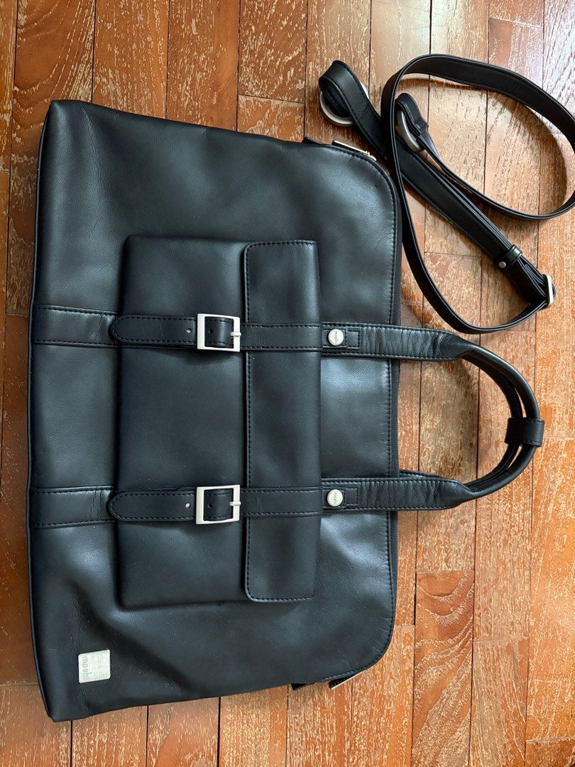 Moshi Treya Briefcase - Jet Black (Category: Briefcases) located in Singapore. Submitted by stuffcool (Listing ID 1378153752, Image 2). Description: Stylish Moshi Treya Briefcase in Jet Black. Features a modern, yet classic look with a premium vegan leather finish. Perfect for professionals on the go. Includes multiple compartments for organization. Brand new, never used..