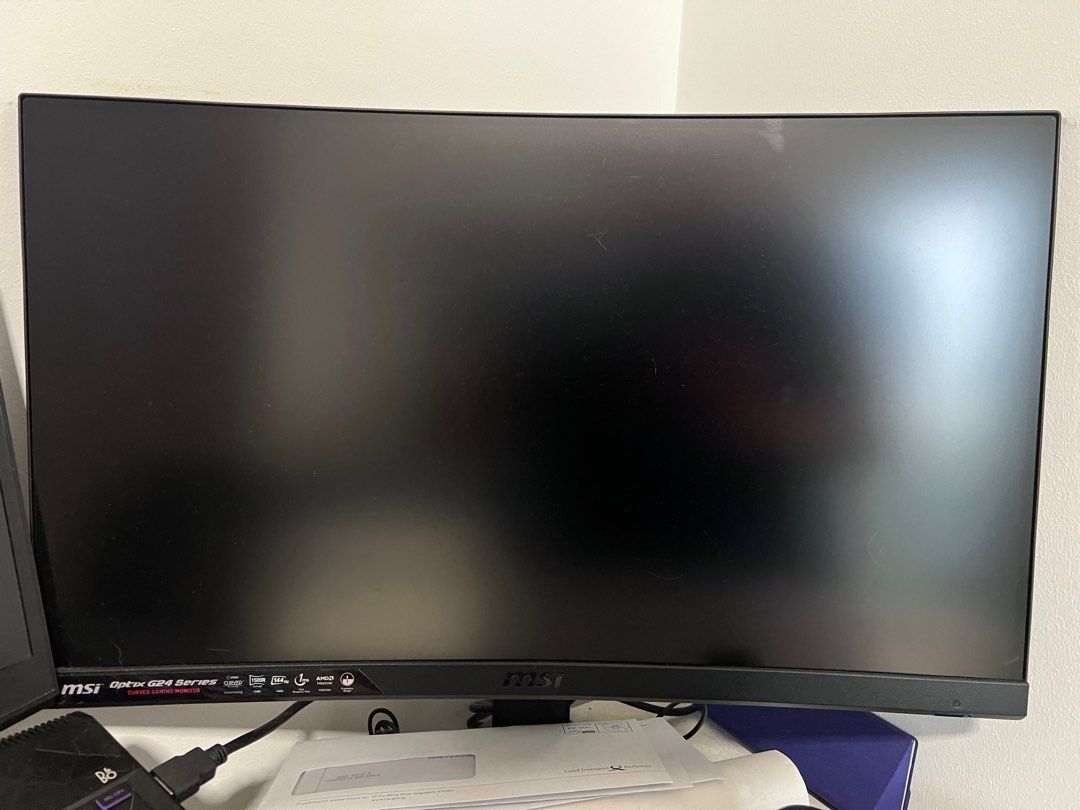 MSI Optix G24 Series Curved Gaming Monitor (Category: Monitor Screens) located in Singapore. Submitted by pqlamz0213 (Listing ID 1378279316, Image 3). Description: Selling a used MSI Optix G24 Series curved gaming monitor. Features a 144Hz refresh rate and 1ms response time. Includes FreeSync technology. Manufactured in March 2021. HDMI port available. Great for gaming and everyday use..