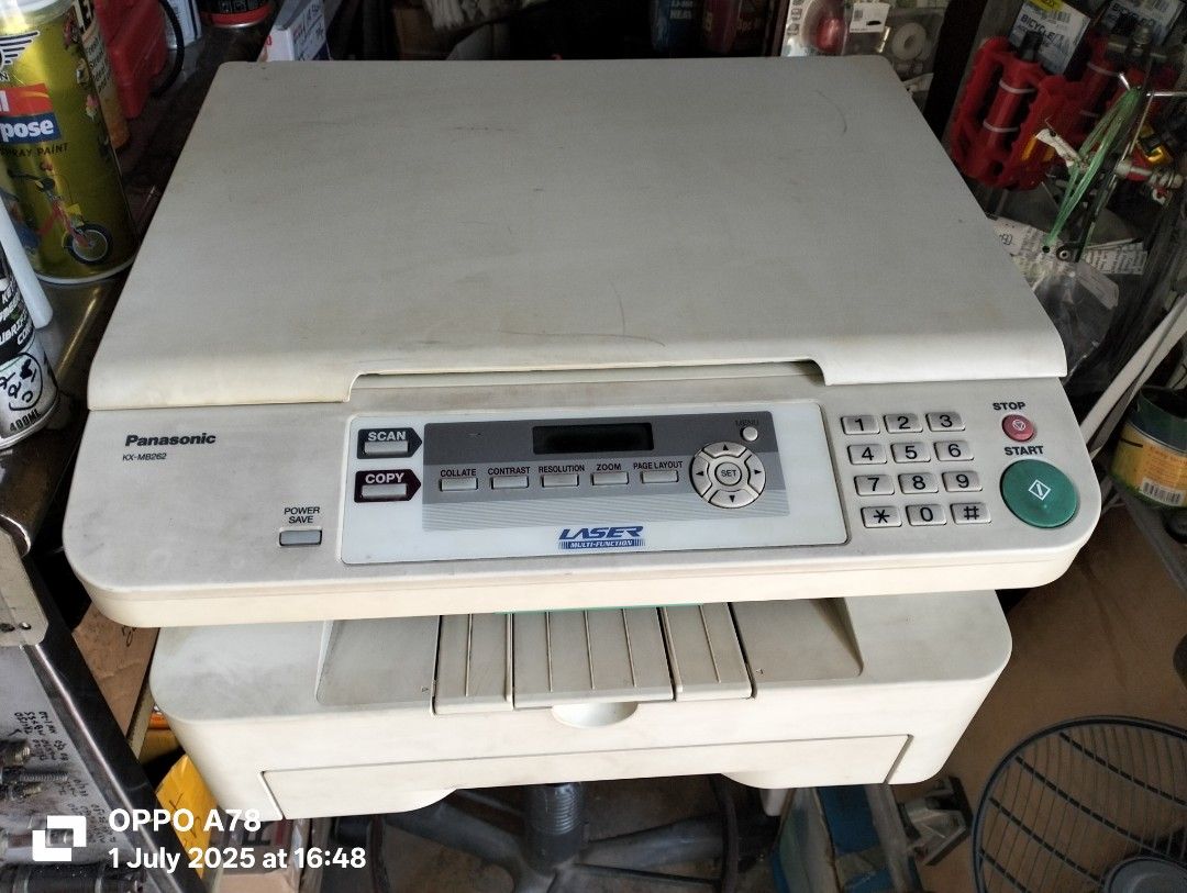 Multifunction Printer (Category: Printers, Scanners & Copiers) located in Singapore. Submitted by pbgresources (Listing ID 1378152725, Image 1). Description: - Panasonic KX-MB262 laser multifunction printer - Functions: Print, Scan, Copy - Features: Paper tray, flatbed scanner - Toner cartridge accessible - In good working condition.