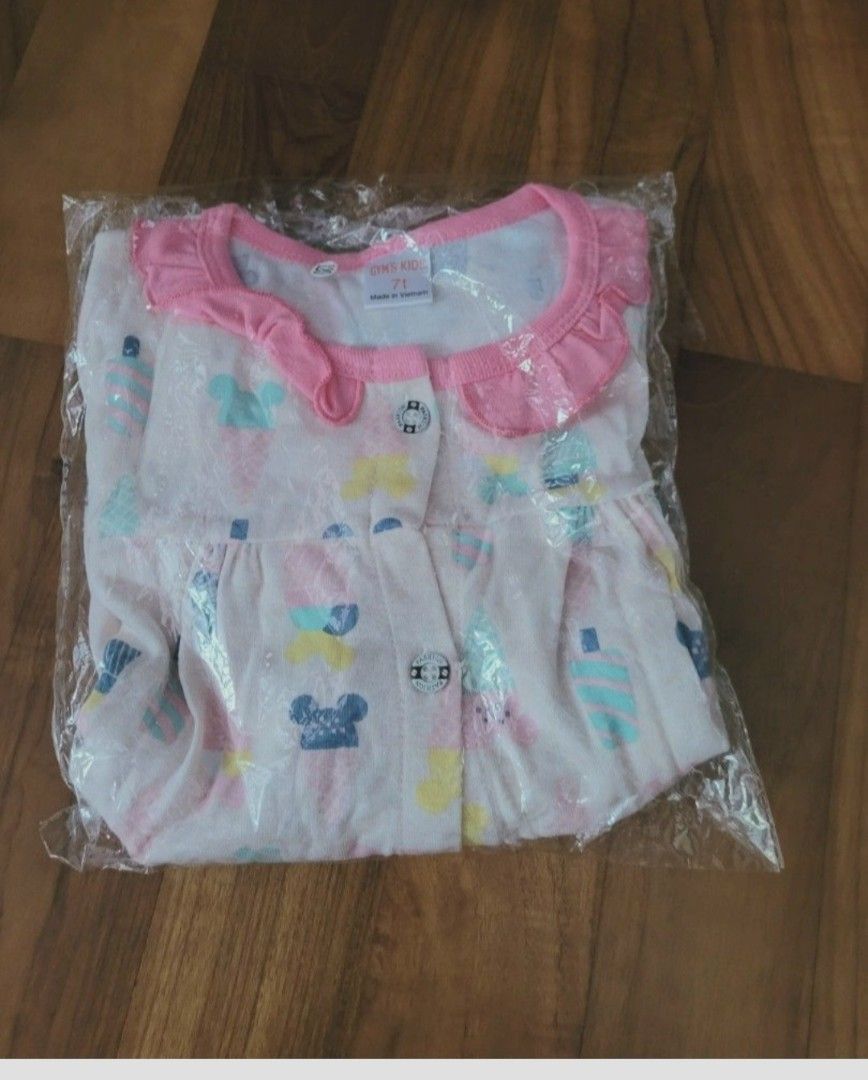 New Kids Set with Mickey Mouse Print size 7T (Category: Babies & Kids Fashion) located in Singapore. Submitted by goodyseally (Listing ID 1378217082, Image 2). Description: - Brand new kids pajama set - Features a cute Mickey Mouse print - Includes a short-sleeved top with a ruffled collar - Matching shorts included - Comes in original packaging.