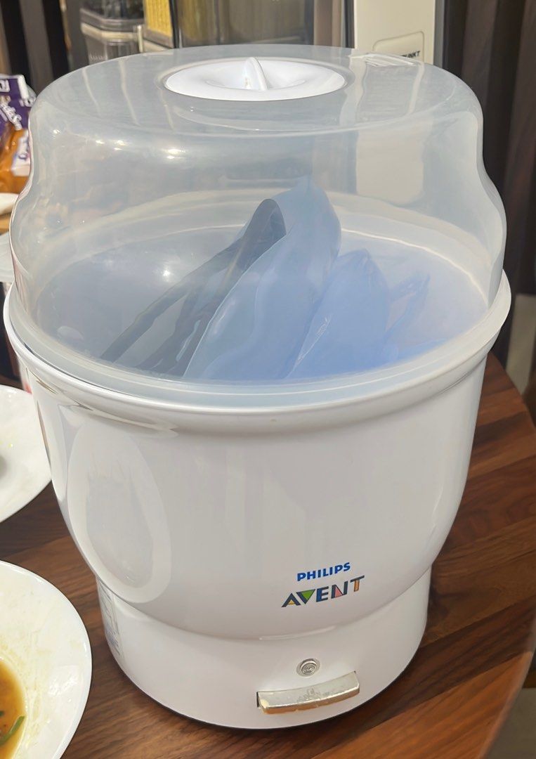 Philips Avent Electric Steam Sterilizer (Category: Breastfeeding & Bottle Feeding) located in Singapore. Submitted by camille (Listing ID 1378301654, Image 1). Description: Sterilizes bottles and accessories quickly and effectively. Easy to use and clean. In good condition, ready for use. Perfect for keeping baby items clean and safe. Includes the lid and the internal tray. Price is negotiable for quick deal!.